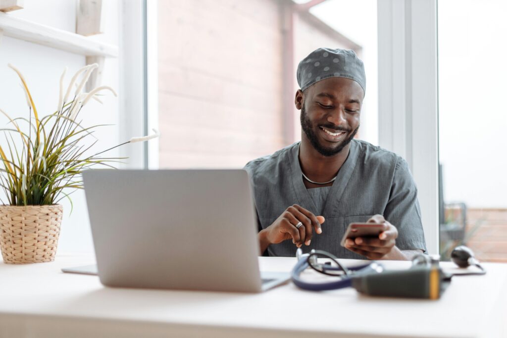 Doctor in a FQHC meets with a patient virtually from his home